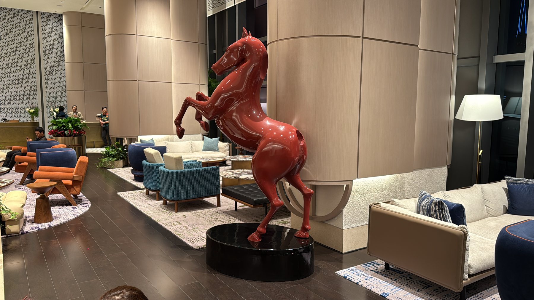 Red horse sculpture in a hotel lounge